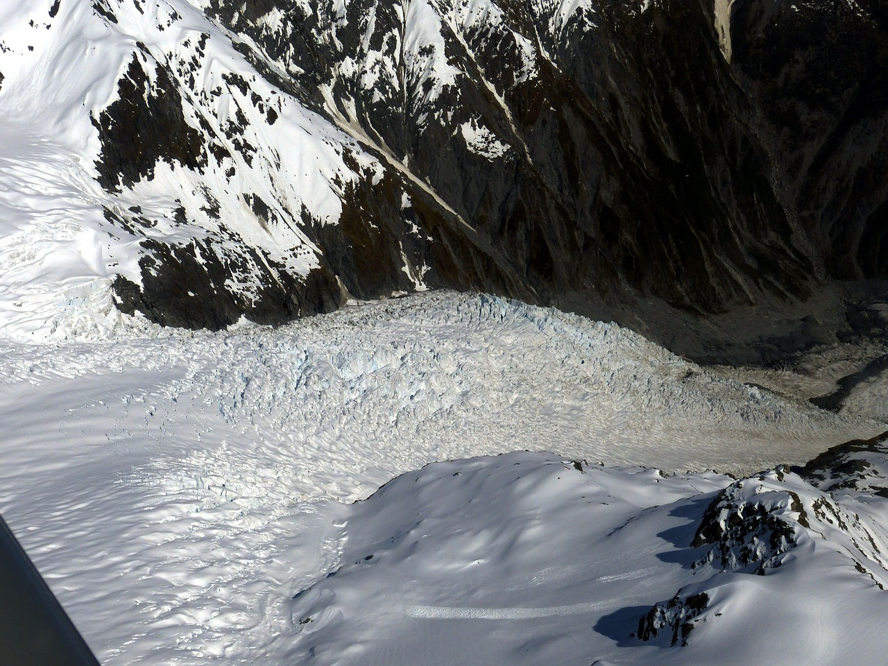 Looking down over the glacier from a helicopter - Things to Do in New Zealand's Glacier Country - The Trusted Traveller