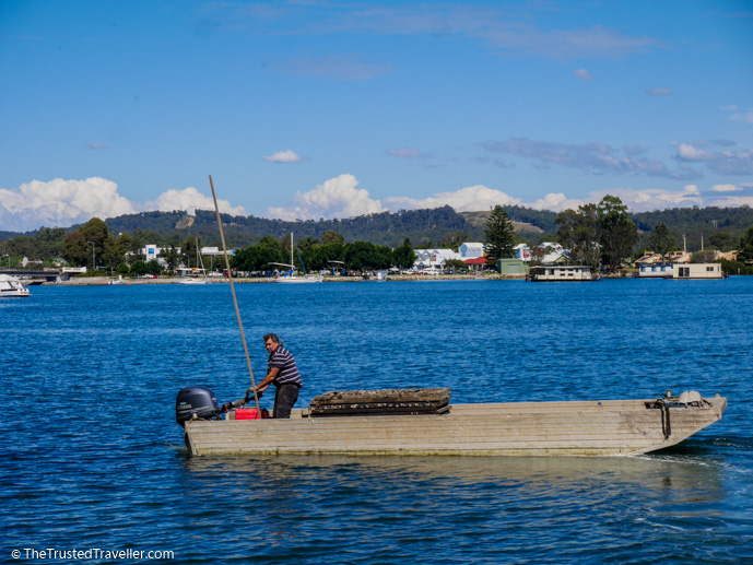 Mark out on his boat going to collect oysters - 7 Eurobodalla Culinary Delights That Should Not to Be Missed - The Trusted Traveller