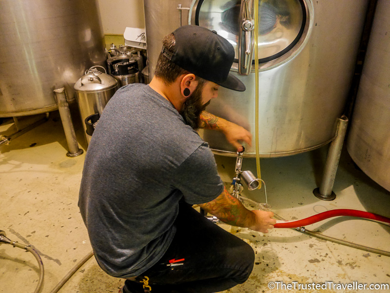 Tasting beer right from the tank at Swans Brewery - How to Visit the Best Craft Breweries in Victoria BC - The Trusted Traveller